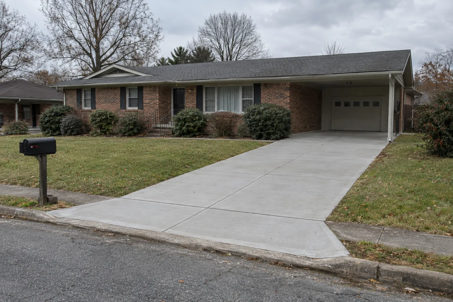 Replaced concrete driveway and new apron at a brick ranch home in Clarksville, TN